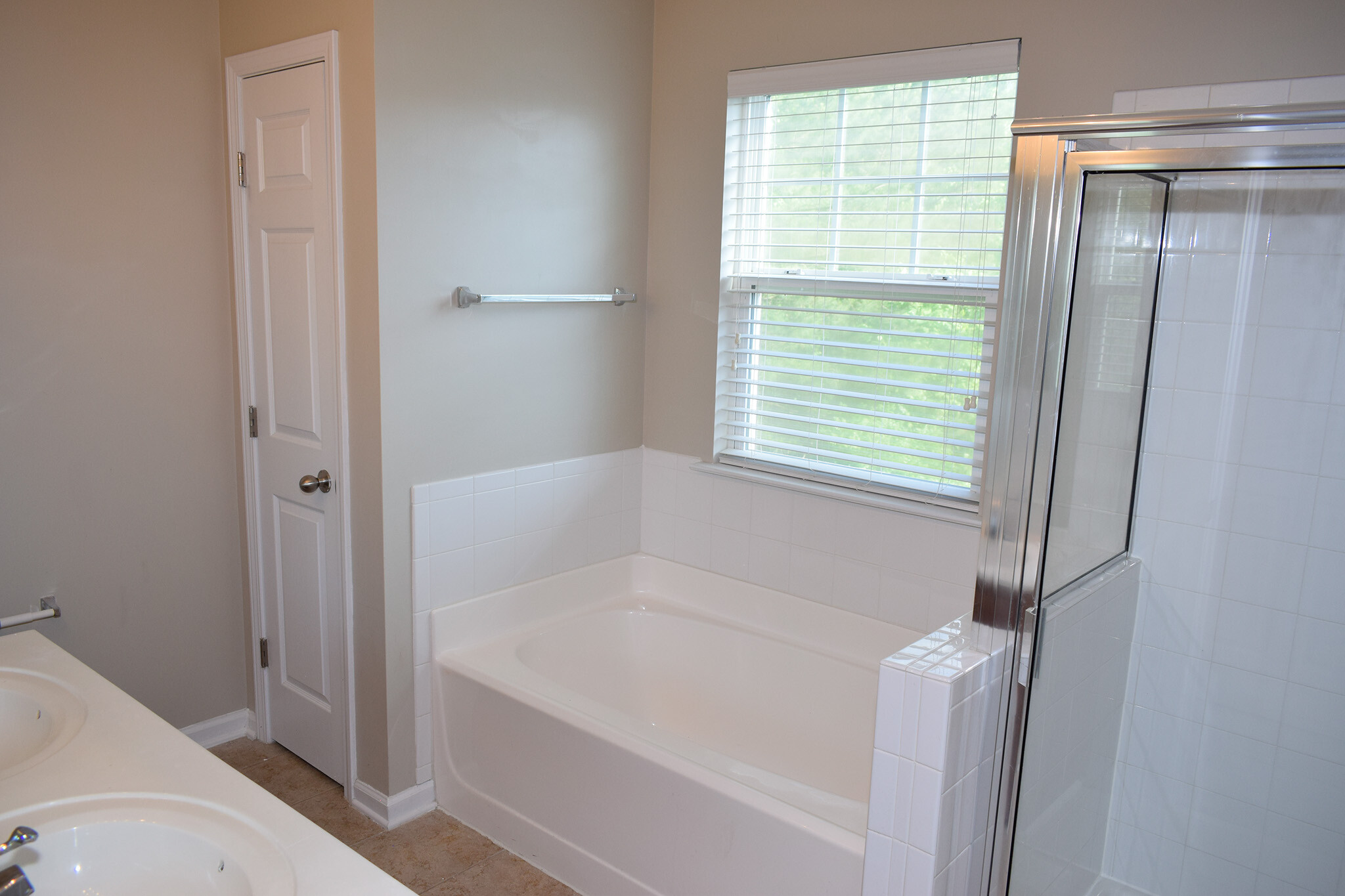 Large garden tub and linen closet in the master bath